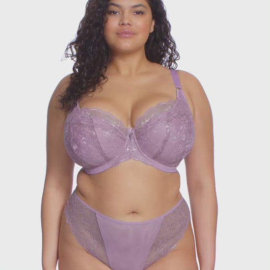 curvy woman wearing a padded big cup plunge bra in heather purple against a white background