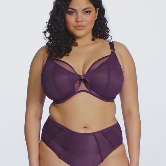 curvy woman wearing a blackberry color big cup bra in mesh with matching brief