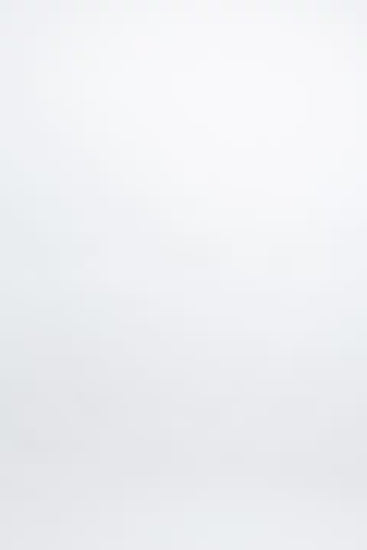 plussize woman wearing a black lingerie set against a white background